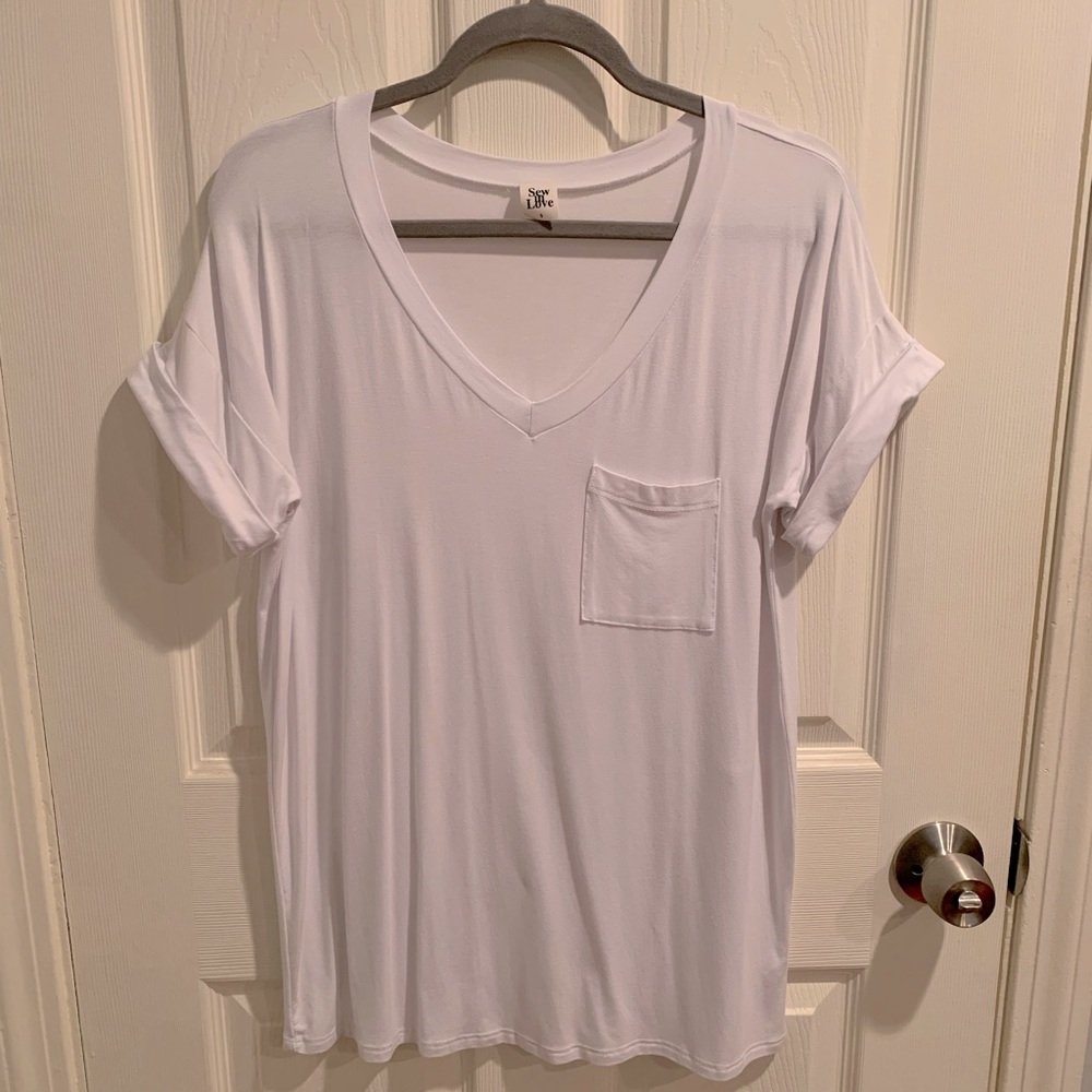 White v-neck T-shirt with cuff sleeve.